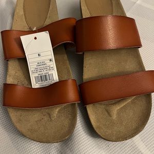 Never worn new wedge heel slides. Good for the beach.